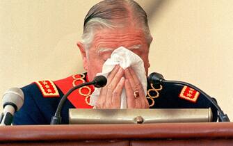 E55-19980310-SANTIAGO-POL: CILE: PINOCHET, CHIESTA INCRIMINAZIONE IN ARGENTINA. Former Chilean dictator General Augusto Pinochet wipes away tears during his farewell speech at the Military Academy 10 March in Santiago during the ceremony marking his retirement from the army command after over 24 years in the post. Pinochet, 82, who ruled Chile for 17 years following the 11 September 1973 CIA-sponsored coup in which he ousted leftist president Salvador Allende, will take a lifetime Senate seat as a former president under the terms of a constitution he pushed through during his dictatorship.       CRIS BOURONCLE/ANSA/TO