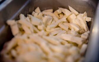 Shredded mozzarella for pizza toppings at a pizzeria in Naples, Italy on Thursday, Feb. 2, 2023. Enjoying one of Italys classic dishes has just become noticeably more expensive, with the average cost of cooking aÂ PizzaÂ Margherita up almost 30% in December from year ago. Photographer: Alessio Paduano/Bloomberg via Getty Images