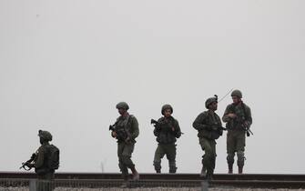 epa10908724 Israeli soldiers patrol the area next to the  border with Gaza, near Sderot, southern Israel, 09 October 2023. The Israeli army announced on 09 October, it carried out over 500 strikes on targets across the Gaza Strip overnight. An unprecedented attack on southern Israel on 07 October claimed by the Islamist movement Hamas killed more than 700 Israelis and left over 2,150 injured, the Israeli army said. In retaliation, Israeli announced operation 'Swords of Iron' against the militant group in the Gaza Strip.  EPA/ATEF SAFADI