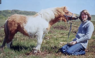 1974:  14 year old Lady Diana Spencer (1961 - 1997), later the wife of Prince Charles, being kissed by her pet pony 'Scuffle'.  (Photo by Hulton Archive/Getty Images)