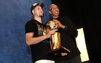 CLEVELAND,OH - Klay of the Golden State Warriors poses with his father Mychal Thompson for a portrait with the Larry O'Brien Championship trophy after defeating the Cleveland Cavaliers after Game Four of the 2018 NBA Finals on June 8, 2018 at Quicken Loans Arena in Cleveland, Ohio. NOTE TO USER: User expressly acknowledges and agrees that, by downloading and/or using this photograph, user is consenting to the terms and conditions of the Getty Images License Agreement. Mandatory Copyright Notice: Copyright 2018 NBAE (Photo by Joe Murphy/NBAE via Getty Images)