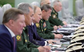epa07249019 Russian Defense Minister Sergei Shoigu (2-L), Russian President Vladimir Putin (3-L) and Head of the Russian Armed Forces General Staff, First Deputy Defense Minister, Army General Valery Gerasimov (4-L) visit the National Defense Control Center in Moscow, Russia, 26 December 2018. During his visit to the National Defense Control Center, Vladimir Putin watched through a video link a successful test launch of the Avangard intercontinental strategic missile with a gliding hypersonic warhead. The Avangard hypersonic intercontinental strategic missile system is to enter into service in 2019.  EPA/MICHAEL KLIMENTYEV / SPUTNIK / KREMLIN POOL / POOL MANDATORY CREDIT