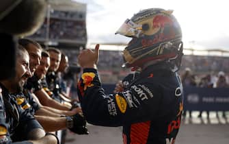 CIRCUIT OF THE AMERICAS, UNITED STATES OF AMERICA - OCTOBER 21: Max Verstappen, Red Bull Racing, 1st position, celebrates with his team in Parc Ferme after the Sprint race during the United States GP at Circuit of the Americas on Saturday October 21, 2023 in Austin, United States of America. (Photo by Glenn Dunbar / LAT Images)