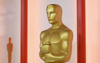 A decorative replica of an Oscar statue stands near the red carpet arrivals area, ahead of the 95th Academy Awards, in Hollywood, California, on March 10, 2023. - The red carpet for the Oscars airing on March 12, 2023, is champagne-color for 2023. (Photo by ANGELA WEISS / AFP) (Photo by ANGELA WEISS/AFP via Getty Images)