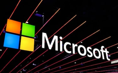 The Microsoft logo is on display at their pavilion during the Mobile World Congress in Barcelona, Spain, on February 28, 2024. Microsoft, the American multinational corporation and technology company, is known for its software products, including the Windows operating systems and the Microsoft 365 suite of productivity applications, such as Word, Excel, and PowerPoint, as well as its hardware products like the Xbox and Microsoft Surface. It is one of the Big Five American IT companies and was founded by Bill Gates. (Photo by Joan Cros/NurPhoto via Getty Images)