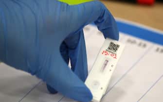 People carry out asymptomatic testing using lateral flow antigen at a test centre at Edinburgh University ahead of students being allowed to travel home for the Christmas holidays.