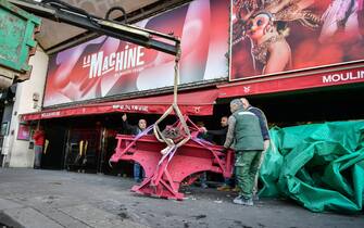 Workers remove the wings of the Moulin Rouge cabaret in Paris on April 25, 2024, after it collapsed last evening. The wings of the windmill on top of the famous Moulin Rouge cabaret fell off during the night on Wednesday the Paris fire department said. No injuries were reported, they said, adding that there was no longer any risk of further collapse. The reasons for the fall are currently unknown. It caused damage to the front of the cabaret, bringing down with it the first three letters of the illuminated sign. Images on social media showed the blade unit lying on the street below, with some of the blades slightly bent from the apparent fall. Photo by Firas Abdullah/ABACAPRESS.COM