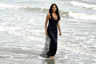 Italian actress Caterina Murino, patroness of the 80th Venice International Film Festival, poses for photographers on August 29, 2023 during a photo call on the beach of the Excelsior Hotel at Lido di Venezia in Venice, Italy, on the eve of the festival's opening. (Photo by Tiziana FABI / AFP) (Photo by TIZIANA FABI/AFP via Getty Images)