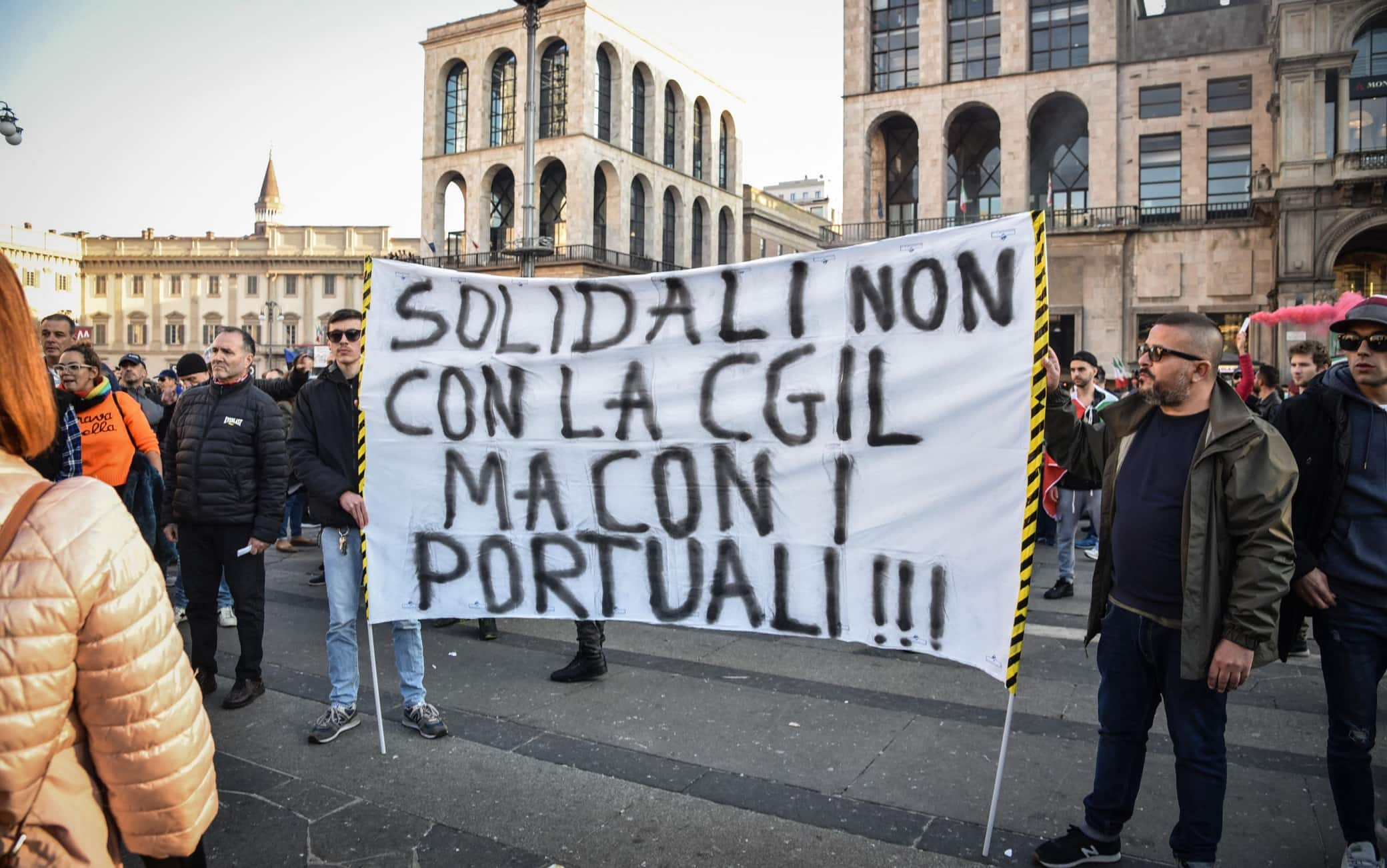 People take part in the No Green Pass rally in Milan, Italy, 16 October 2021. Starting from 15 October, Italian workers from the public and private sectors are required to hold the 'Green Pass' vaccine passport. ANSA/MATTEO CORNER