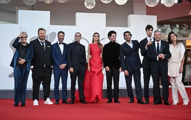 From left : actress Chiara Noschese, Giorgio Montanini, actor Matteo Branciamore, Adamo Dionisi, actress Benedetta Porcaroli, actor Giorgio Quarzo Guarascio, director Pietro Castellitto, Cesare Castellitto and Sergio Castellitto pose during the red carpet of the movie "Enea" presented in competition at the 80th Venice Film Festival on September 5, 2023 at Venice Lido. (Photo by Tiziana FABI / AFP) (Photo by TIZIANA FABI/AFP via Getty Images)