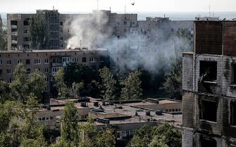 epa10750411 Smoke rises over destroyed apartment blocks after shelling in Vuhledar town, Donetsk region, Ukraine, 16 July 2023. Located in the southern part of Donetsk region, Vuhledar is a frontline town. Before Russia's ongoing invasion of Ukraine, the population of the town was 14432 citizens. Currently, less than 100 citizens live there, based on different calculations and since 24 February 2022, 59 citizens, including three children, have been killed. There are no buildings that are not damaged or ruined, there is no infrastructure, no water and no electricity. The Russian army tried to assault Ukrainian positions around the town, but were unsuccessful. Russian troops entered Ukraine on 24 February 2022 starting a conflict that has provoked destruction and a humanitarian crisis.  EPA/OLEG PETRASYUK  ATTENTION: This Image is part of a PHOTO SET
