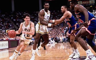 SALT LAKE CITY - 1989:  John Stockton #12 of the Utah Jazz drives to the basket around a Karl Malone #32 pick against the New York Knicks circa 1989 at the Delta Center in Salt Lake City, Utah. NOTE TO USER: User expressly acknowledges and agrees that, by downloading and/or using this Photograph, user is consenting to the terms and conditions of the Getty Images License Agreement.  Mandatory Copyright Notice: Copyright 1989 NBAE (Photo by Andrew D. Bernstein/NBAE via Getty Images)