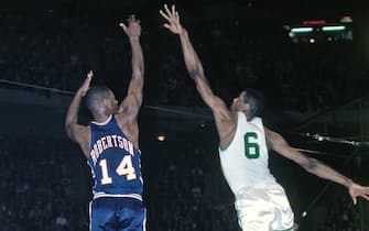 BOSTON - 1964:  Oscar Robertson #14 of the Cincinnati Royals shoots a jump shot over Bill Russell #6 of the Boston Celtics during a game played in 1964 at the Boston Garden in Boston, Massachusetts. NOTE TO USER: User expressly acknowledges and agrees that, by downloading and or using this photograph, User is consenting to the terms and conditions of the Getty Images License Agreement. Mandatory Copyright Notice: Copyright 1964 NBAE (Photo by Dick Raphael/NBAE via Getty Images)