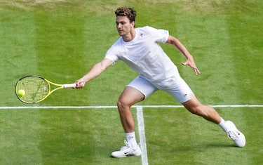 Miomir Kecmanovic in action during his GentlemenÕs Singles third round match against Novak Djokovic during day five of the 2022 Wimbledon Championships at the All England Lawn Tennis and Croquet Club, Wimbledon. Picture date: Friday July 1, 2022.
