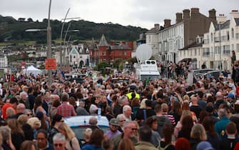 Fans of singer Sinead O'Connor line the streets for a "last goodbye" to the Irish singer as her funeral cortege passes through her former hometown of Bray, Co Wicklow, ahead of a private burial service. Picture date: Tuesday August 8, 2023.