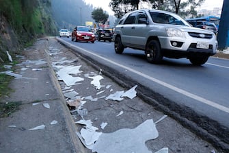 Picture of debris after a pedestrian bridge was damaged by an explosion late on January 8, over the General Rumiñahui highway in the Monjas sector in Quito, taken on January 9, 2024, a day after Ecuadorean President Daniel Noboa declared a state of emergency following the escape from prison of a dangerous narco boss. At least four police officers were kidnapped in Ecuador following a declaration of a 60-day state of emergency on January 8 after dangerous gang leader Adolfo Macias, also known as "Fito," escaped from maximum security detention. (Photo by Galo PAGUAY / AFP)