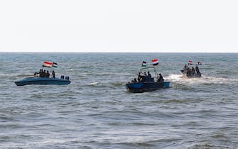 Members of the Yemeni Coast Guard affiliated with the Houthi group patrol the sea as demonstrators march through the Red Sea port city of Hodeida in solidarity with the people of Gaza on January 4, 2024, amid the ongoing battles between Israel and the militant Hamas group in Gaza. (Photo by AFP)