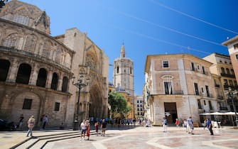 Valencia Cathedral (13th Century) and the Torre Del Micalet at the Plaza de la Almoina in the center of Valencia, Spain