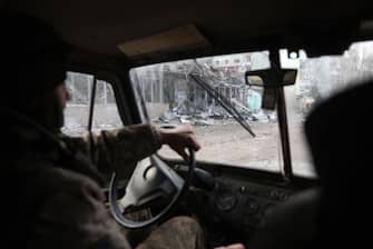 A Ukrainian serviceman drives a vehicle in the town of Bakhmut, in the Donetsk region on March 3, 2023. (Photo by Anatolii Stepanov / AFP) (Photo by ANATOLII STEPANOV/AFP via Getty Images)