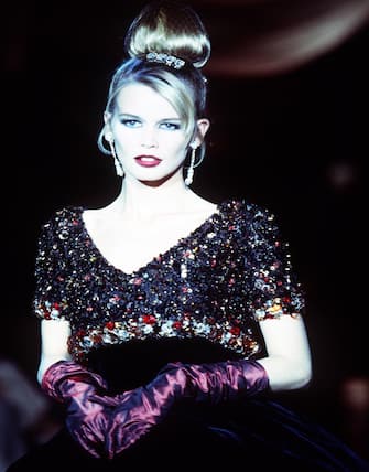 PARIS, FRANCE - JULY: Claudia Schiffer walks the runway at the Dior Haute Couture Fall/Winter 1995-1996 show by Gianfranco Ferre during the Paris, Fashion Week in July, 1995 in Paris, France. (Photo by Victor VIRGILE/Gamma-Rapho via Getty Images)
