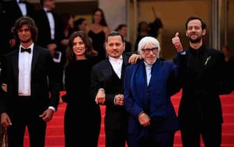 (From L) French actor Diego Le Fur, French actress and director Maiwenn, US actor Johnny Depp, French actor Pierre Richard and French actor Benjamin Lavernhe arrive for the opening ceremony and the screening of the film "Jeanne du Barry" during the 76th edition of the Cannes Film Festival in Cannes, southern France, on May 16, 2023. (Photo by Valery HACHE / AFP) (Photo by VALERY HACHE/AFP via Getty Images)