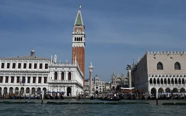 TOPSHOT - A general view shows St Mark's Campanile and a part of the Doge's Palace (R) on September 3, 2023 in Venice. (Photo by GABRIEL BOUYS / AFP) (Photo by GABRIEL BOUYS/AFP via Getty Images)