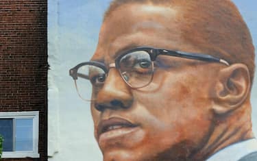 PHILADELPHIA, CALIFORNIA - SEPTEMBER 10: Mural illustrating African American Muslim minister and human rights activist Malcom X, painted within the "Mural Art Program" which began in 1984. It's an anti-graffiti program in a city economically devastated, to offer beauty and a social direction to the communities on September 10, 2013 in Philadelphia, Pennsylvania, United States. (Photo by FrÃ©dÃ©ric Soltan/Corbis via Getty Images)