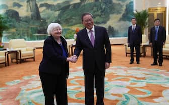epa11263405 U.S. Treasury Secretary Janet Yellen (L) shakes hands with Chinese Premier Li Qiang at the Great Hall of the People in Beijing, China, 07 April  2024. Yellen, who arrived in Beijing after starting her five-day visit in Guangdong province, one of China's major industrial and export hubs, said that talks will create a structure to hear each other's views and try to address American concerns about manufacturing overcapacity in China.  EPA/Tatan Syuflana / POOL