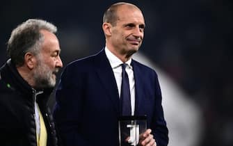 Juventus Italian coach Massimiliano Allegri receives the award for his 405th presence on the bench for Juventus before the Italian Serie A football match Juventus vs Udinese on February 12, 2024 at the “Allianz Stadium” in Turin. (Photo by MARCO BERTORELLO / AFP)