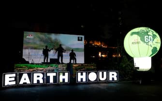 epa11981391 Indonesian artist sing on the stage during Earth Hour at the Sudirman Central Business District (SCBD) in Jakarta, Indonesia, 22 March 2025. Earth Hour is held annually, usually on the last Saturday of March, as a symbol of commitment to the planet by encouraging individuals, communities and businesses to give one hour to the Earth by switching off non-essential electric lights.  EPA/BAGUS INDAHONO