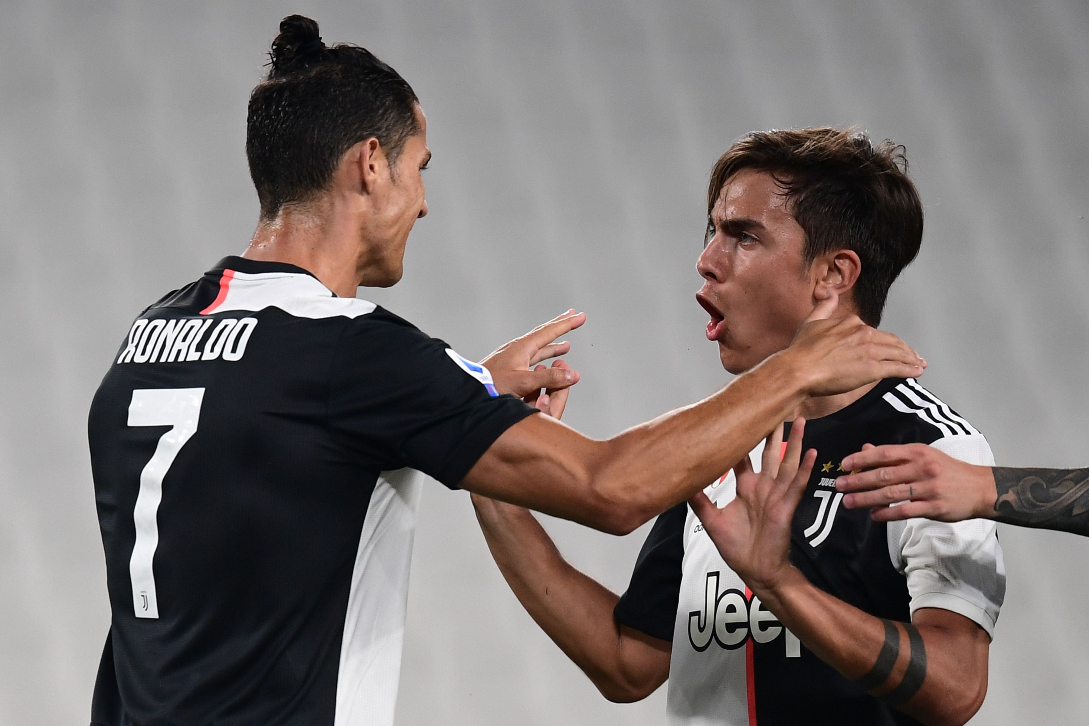 Turin, Italy - 26 June, 2020: Paulo Dybala (C) of Juventus FC celebrates  with Cristiano Ronaldo (R) and Federico Bernardeschi (L) of Juventus FC  after scoring a goal during the Serie A