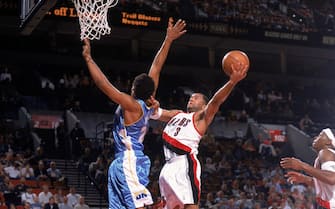 PORTLAND, OR - OCTOBER 20: Damon Stoudamire #3 of the Portland Trail Blazers makes a layup against Andre Miller #24 of the Denver Nuggets at the Rose Garden on October 20, 2003 in Portland, Oregon. The Nuggets won 101-95. NOTE TO USER: User expressly acknowledges and agrees that, by downloading and/or using this Photograph, User is consenting to the terms and conditions of the Getty Images License Agreement. Mandatory copyright notice:  Copyright 2003 NBAE (Photo by: Sam Forencich/NBAE via Getty Images)