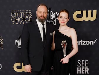 SANTA MONICA, CALIFORNIA - JANUARY 14: Yorgos Lanthimos and Emma Stone, winner of the Best Actress Award for "Poor Things," during the 29th Annual Critics Choice Awards at Barker Hangar on January 14, 2024 in Santa Monica, California. (Photo by Frazer Harrison/Getty Images)