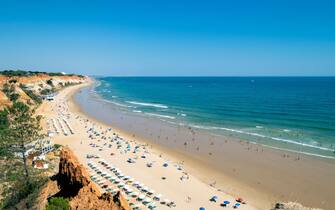 Portugal, Algarve, falesia beach " praia da falésia ". South Portugal tourism with beautiful beaches and hotels. Summer beach time in Algarve. European