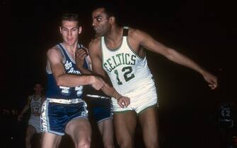 BOSTON, MA - CIRCA 1965:  Jerry West #44 of the Los Angeles Lakers fights for position with Willie Naulls #12 of the Boston Celtics during an NBA basketball game circa 1965 at the Boston Garden in Boston, Massachusetts. West played for the Lakers from 1960-74. (Photo by Focus on Sport/Getty Images) 