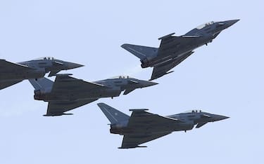 LAAGE, GERMANY - AUGUST 19:  Eurofighter military jets of the German Luftwaffe fly over spectators during an airshow marking the 50th anniversary of the modern Luftwaffe August 19, 2006 in Laage, Germany. The Eurofighter is Europe's most modern jet fighter.  (Photo by Sean Gallup/Getty Images)