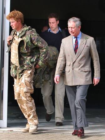 PRINCE HARRY IS MET BY HIS FATHER PRINCE CHARLES AND BROTHER WILLIAM UPON ARRIVING AT RAF BRIZE NORTON IN OXFORDSHIRE HAVING BEEN FORCED TO CUT SHORT HIS TOUR OF DUTY IN AFGHANISTAN DUE A A FOREIGN PRESS LEAK. PICTURES /., Credit:Barry Clack / Avalon