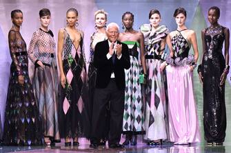 PARIS, FRANCE - JANUARY 24: (EDITORIAL USE ONLY - For Non-Editorial use please seek approval from Fashion House) Fashion designer Giorgio Armani poses with models on the runway during the Giorgio Armani Prive Haute Couture Spring Summer 2023 show as part of Paris Fashion Week on January 24, 2023 in Paris, France. (Photo by Stephane Cardinale - Corbis/Corbis via Getty Images)