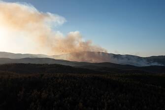 Smoke rises over a wildfire near the National Park of Dadia, Alexandroupolis, Greece, on Monday, Aug. 28, 2023. With more than 72,000 hectares burnt, the Alexandroupolis wildfire in Evros is the largest on record in the EU. Photographer: Konstantinos Tsakalidis/Bloomberg via Getty Images