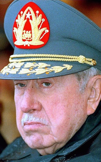 MVD53 - 19970911 - SANTIAGO, CHILE :  PINOCHET : A GIUDIZIO , GIORNO STORICO PER IL CILE --- (FILES): This 07 September 1997 file photo shows former Chilean dictator Augusto Pinochet in Santiago, who will stand trial to answer murder and kidnapping charges related to a military campaign to eliminate opposition to his rule, a judge said 29 January 2001. Judge Juan Guzman said Pinochet will be prosecuted in connection with the deaths and disappearances of 75 political prisoners in the first weeks following his seizure of power in September 1973 coup. Guzman is coordinating 214 cases against the 85-year-old former dictator, who ruled with an iron fist from 1973 until 1990. ANSA/JI- EPA PHOTO AFP FILES/CRIS BOURONCLE/gr-hh/no/dc/pp/dec