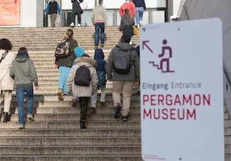 22 October 2023, Berlin: Visitors walk up the steps to the James Simon Gallery to visit the Pergamon Museum on the last day of visitors. The world-famous building will be closed for many years starting tomorrow. The reason is extensive renovation and restoration work. Photo: Paul Zinken/dpa (Photo by Paul Zinken/picture alliance via Getty Images)