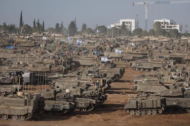 epa11329418 Israeli military vehicles gathered near the border fence with the Gaza Strip, at an undisclosed location in southern Israel, 09 May 2024. On 07 May, Israel said that its troops began an operation targeting Hamas militants and infrastructure within specific areas of eastern Rafah, taking operational control of the Gazan side of the Rafah crossing. The United States on 08 May confirmed the decision to pause a shipment of 'high payload munitions' to Israel. More than 34,900 Palestinians and over 1,455 Israelis have been killed, according to the Palestinian Health Ministry and the Israel Defense Forces (IDF), since Hamas militants launched an attack against Israel from the Gaza Strip on 07 October 2023, and the Israeli operations in Gaza and the West Bank which followed it.  EPA/ABIR SULTAN