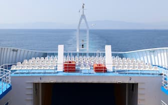 empty rows white seats on ferryboat deck terrace, sea