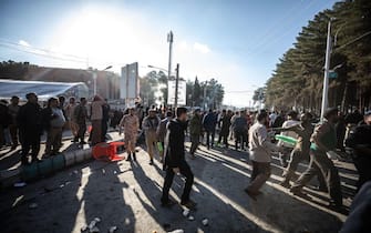 epa11055223 People try to help victims after explosions at a commemoration ceremony next to the tomb of Iran's Revolutionary Guards chief of foreign operations Iranian General Qasem Soleimani in the Saheb al-Zaman mosque in the southern city of Kerman, Iran, 03 January 2024. On the fourth anniversary of the assassination of Iranian General Qasem Soleimani, two explosions have killed at least 73 people and another 171 people were wounded near the mausoleum dedicated to him, according to Iranian official television. As part of a ceremony to honor General Soleimani, who was killed in a drone strike in neighboring Iraq in 2020, hundreds of people were on their way towards the grave on 03 January.  EPA/MEHR NEWS AGENCY