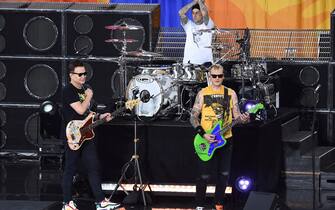 , New York, NY - 20190719- Blink-182 Perform On The Good Morning America Summer Concert Series. 

-PICTURED: Mark Hoppus, Travis Barker and Matt Skiba
-PHOTO by: Media Punch/INSTARimages.com

This is an editorial, rights-managed image. Please contact Instar Images LLC for licensing fee and rights information at sales@instarimages.com or call +1 212 414 0207 This image may not be published in any way that is, or might be deemed to be, defamatory, libelous, pornographic, or obscene. Please consult our sales department for any clarification needed prior to publication and use. Instar Images LLC reserves the right to pursue unauthorized users of this material. If you are in violation of our intellectual property rights or copyright you may be liable for damages, loss of income, any profits you derive from the unauthorized use of this material and, where appropriate, the cost of collection and/or any statutory damages awarded