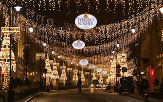 Festive lights illuminate Ferrero Rocher logos over Nowy Swiat street in Warsaw, Poland, on Thursday, Dec. 17, 2020. The Polish central bank ended the year with its biggest bond-buying auction since July, but it wasnt enough to change the picture in the quietest quarter for quantitative easing since the governments program started. Photographer: Lukasz Sokul/Bloomberg via Getty Images