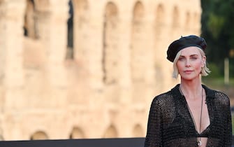 South African and American actress Charlize Theron arrives for the Premiere of the film "Fast X", the tenth film in the Fast & Furious Saga, on May 12, 2023 at the Colosseum monument in Rome. (Photo by Alberto PIZZOLI / AFP) (Photo by ALBERTO PIZZOLI/AFP via Getty Images)