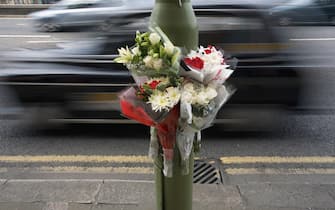 A floral tribute fastened to a lamp post at the scene of a fatal road accident in Birmingam city centre, UK. The flowers were placed there by family and friends of the victim.