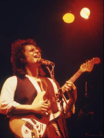 The Italian singer-songwriter Pino Daniele sings and plays the guitar on stage during a concert. Italy, 1982 (Photo by Angelo Deligio/Mondadori Portfolio via Getty Images)
