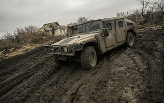 A Ukrainian armored vehicle drives on a muddy road near Bakhmut in the Donbas region, on March 9, 2023. - After a cold and snowy winter, the arrival of spring with rain and milder temperatures has brought back the mud on the Donbas battle fields.
Trenches that have become baths where soldiers wade through and trucks, armoured cars and sometimes tanks destroyed after getting stuck in mud. (Photo by Aris Messinis / AFP) (Photo by ARIS MESSINIS/AFP via Getty Images)